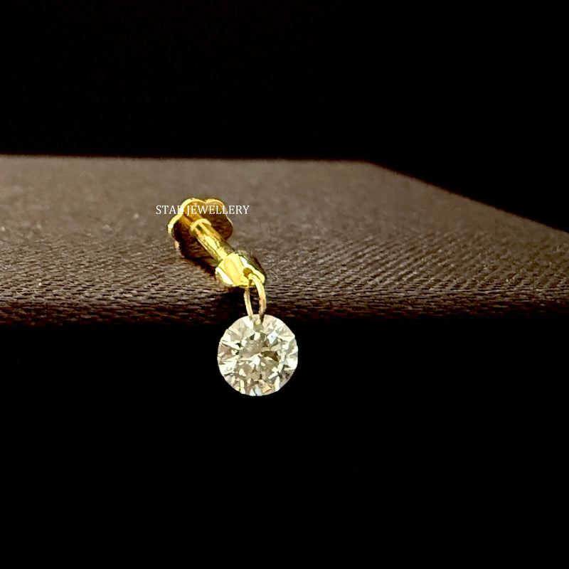 Floating round diamond stud earring in 14K gold