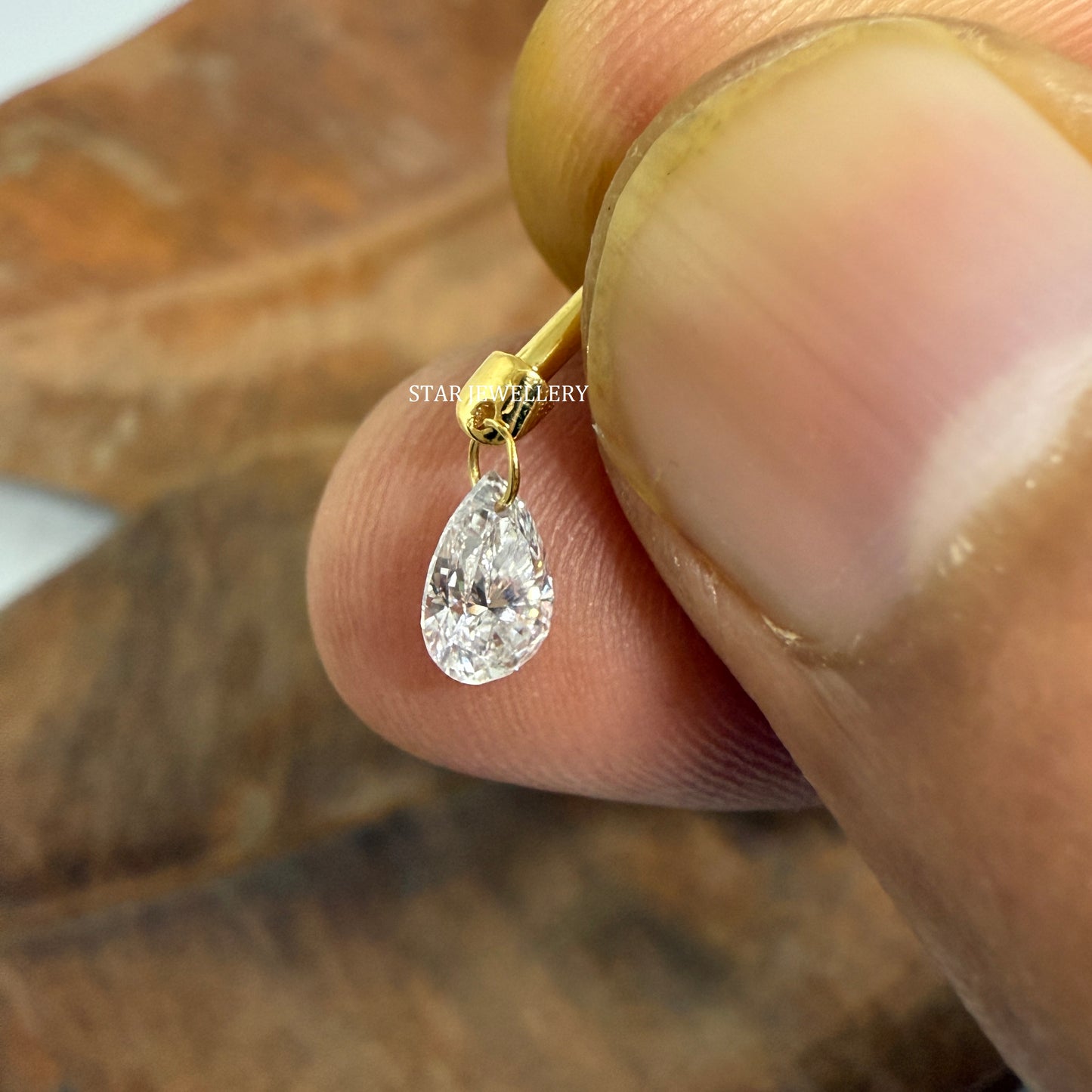 Floating Pear Diamond Stud Earring