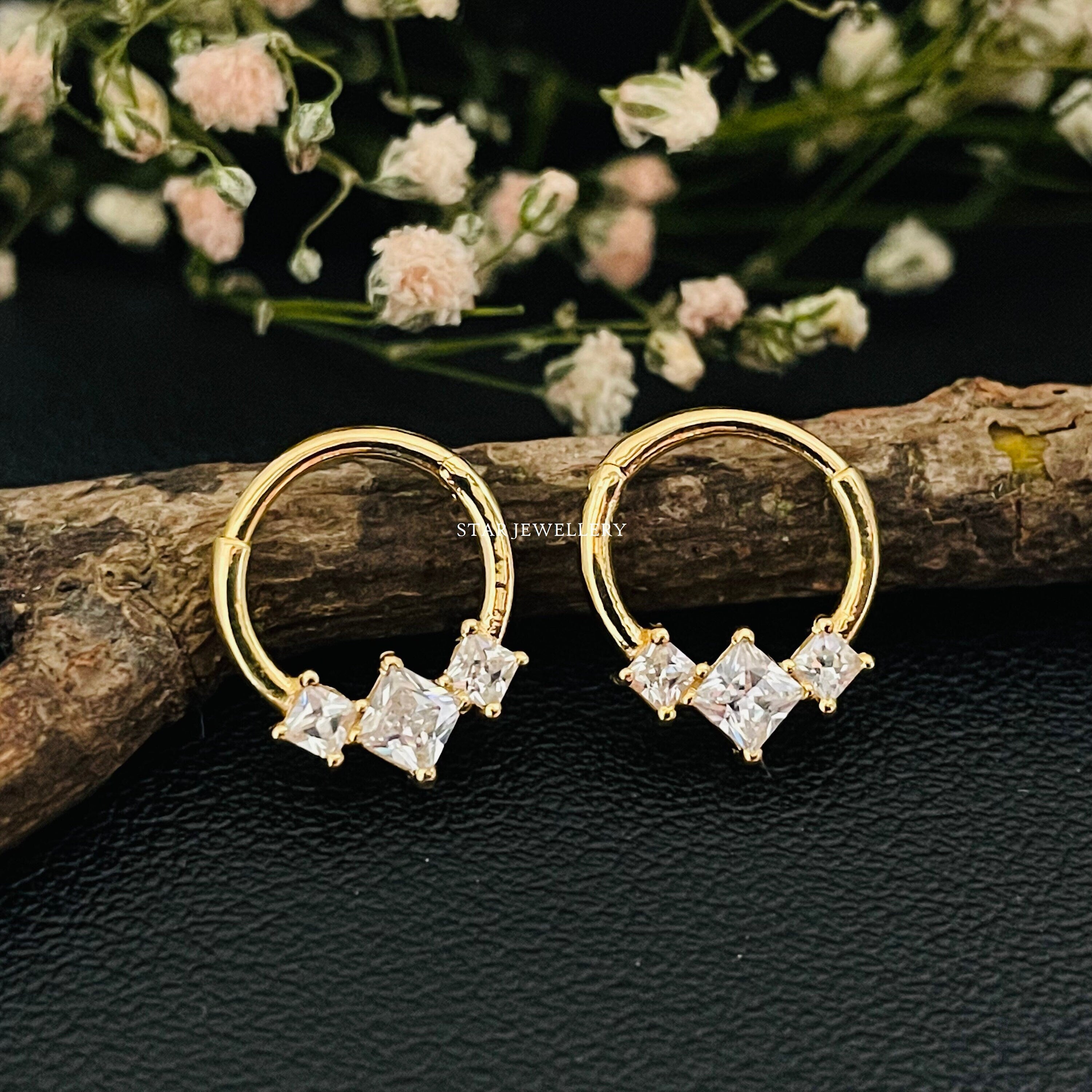 Gold septum, daith and helix piercing jewelry with diamond detail, styled together for 2026