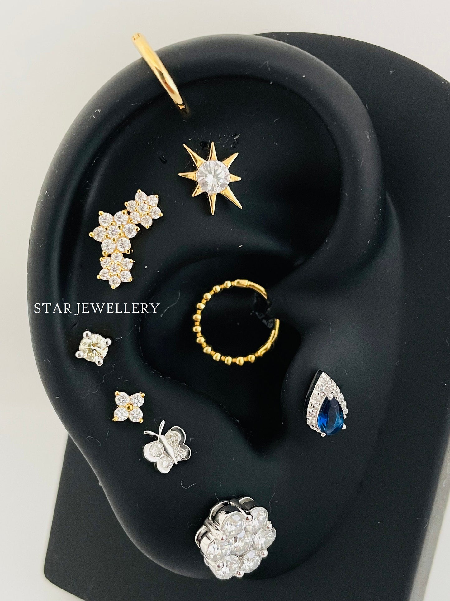Pear Shape Anti Tragus Piercing with Green Emerald
