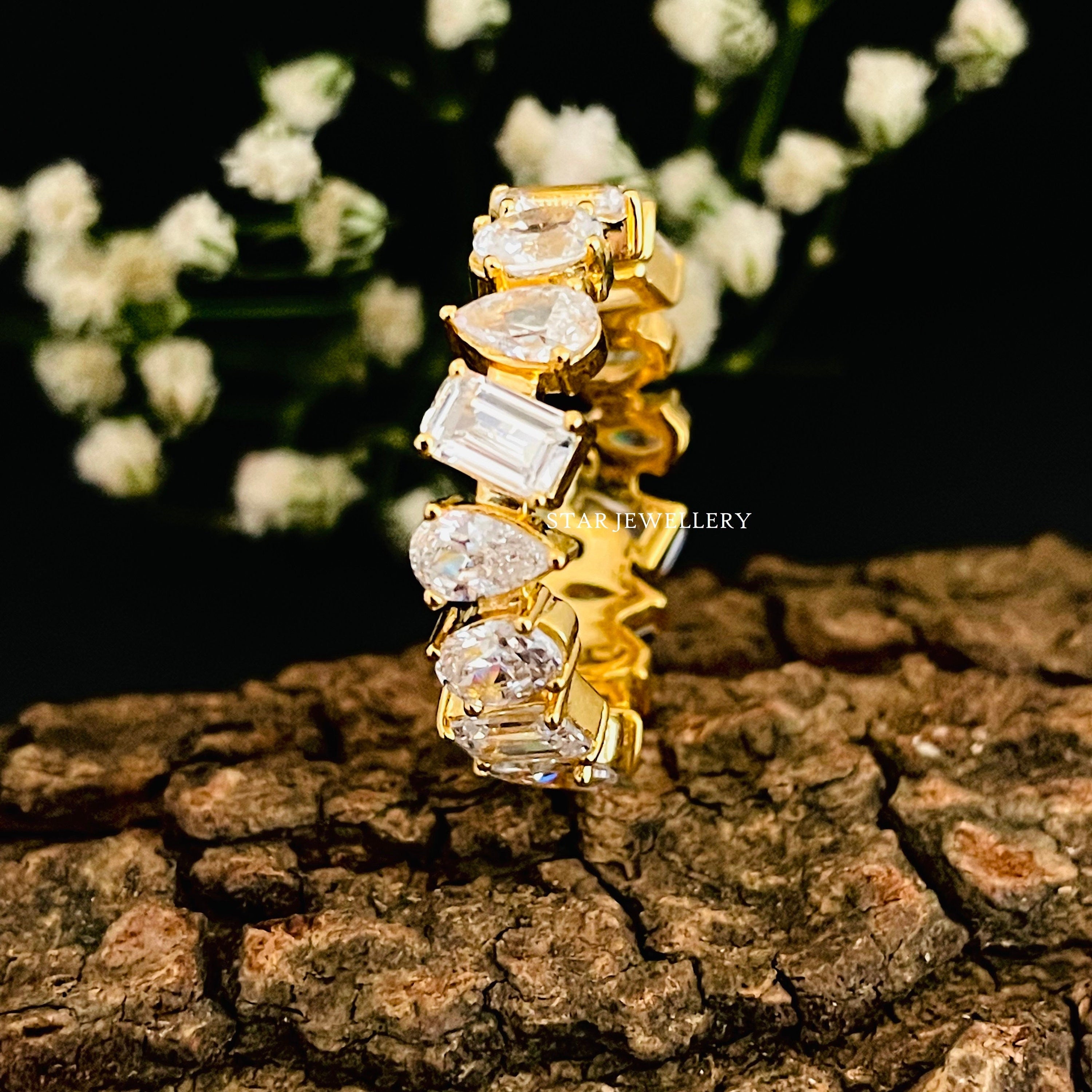 Multi shape brilliant cut moissanite eternity ring in gold